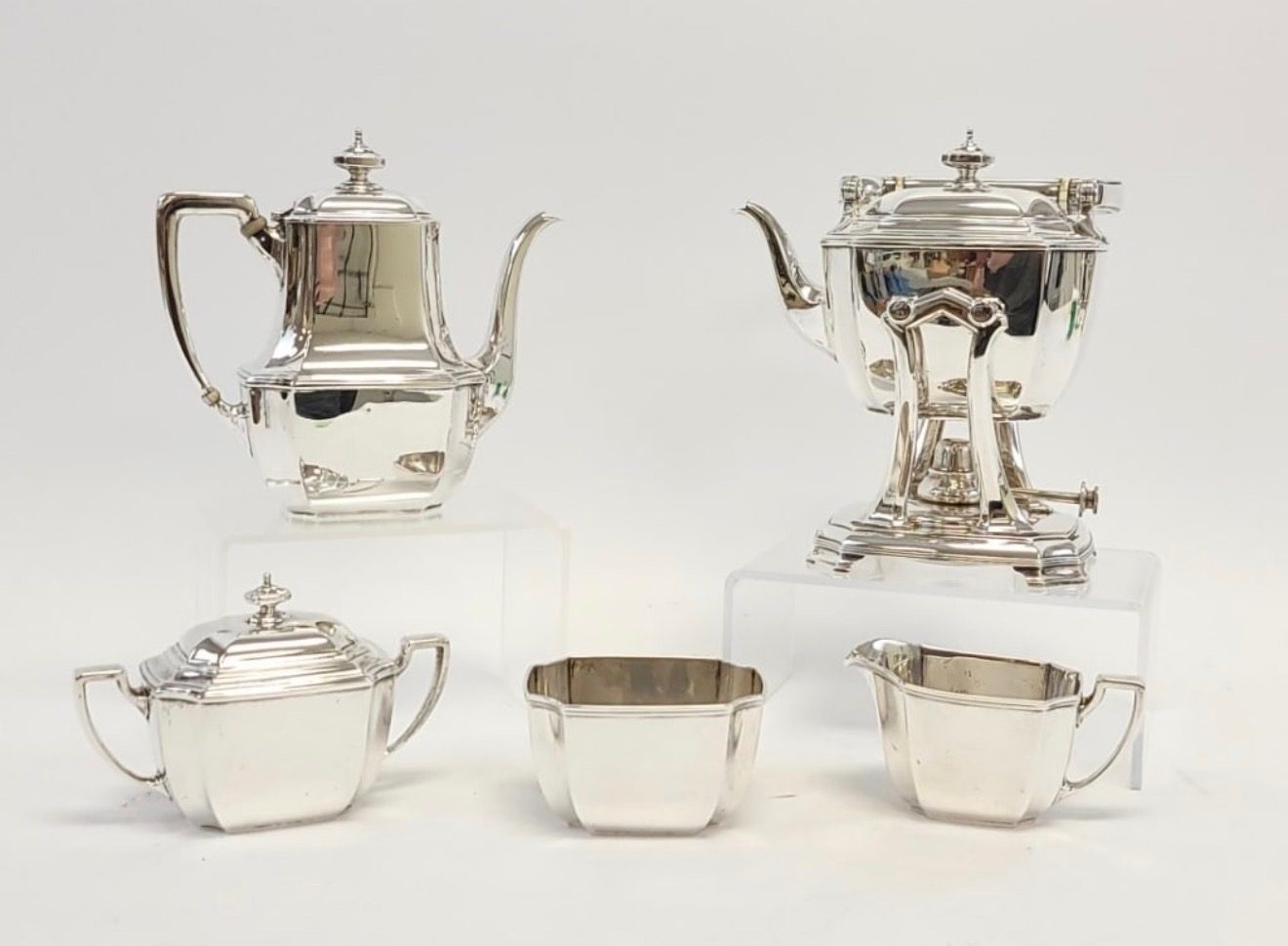A sterling silver tea and coffee service: coffee pot, kettle on stand, sugar bowl, creamer and waste bowl